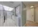 Convenient in-unit laundry with stacked washer and dryer near the kitchen at 440 S Gulfview Blvd # 701, Clearwater Beach, FL 33767