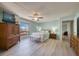 The primary bedroom features wood-look floors, ceiling fan, dresser and an exterior view at 440 S Gulfview Blvd # 701, Clearwater Beach, FL 33767