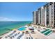 Condo pool deck featuring a pool, lounge chairs, gazebo and shuffleboard court at 440 S Gulfview Blvd # 701, Clearwater Beach, FL 33767