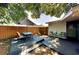 Outdoor dining on a shaded patio featuring table and seating surrounded by a wooden fence at 4505 S Clark Ave, Tampa, FL 33611