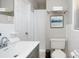 Clean bathroom featuring a vanity, toilet, and shower with fresh white towels at 4505 S Clark Ave, Tampa, FL 33611