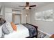 Comfortable bedroom with a ceiling fan, neutral walls, and a cozy bed at 4505 S Clark Ave, Tampa, FL 33611