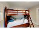 Bedroom with a wooden bunk bed and ample storage at 4505 S Clark Ave, Tampa, FL 33611