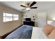 Well-lit bedroom with dark dresser and shelves for storage and decor at 4505 S Clark Ave, Tampa, FL 33611
