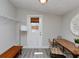 Versatile dining area with wood flooring, a dining table set, and convenient access to the outdoors at 4505 S Clark Ave, Tampa, FL 33611
