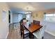 Bright dining room features a wood table, modern light fixture, and decor at 4505 S Clark Ave, Tampa, FL 33611