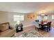 Comfortable and inviting dining room with hardwood floors and large windows for natural light at 4505 S Clark Ave, Tampa, FL 33611