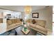 Inviting living room featuring neutral color scheme, plush sofas, and an open kitchen view at 4505 S Clark Ave, Tampa, FL 33611