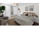 Serene bedroom with light walls, wood floors, and modern decor for a relaxing atmosphere at 4718 W Oklahoma Ave, Tampa, FL 33616