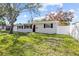 Charming single-story home with a well-maintained lawn and a freshly painted exterior at 4718 W Oklahoma Ave, Tampa, FL 33616