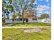 Charming single-story home with a well-maintained lawn and a freshly painted exterior at 4718 W Oklahoma Ave, Tampa, FL 33616