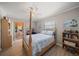 Inviting bedroom with a four-poster bed, complemented by natural light and access to the outdoor patio at 4754 Overlook Ne Dr, St Petersburg, FL 33703