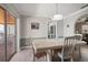 Bright dining area with sliding doors to a patio, features neutral tones and an adjacent kitchen view at 4754 Overlook Ne Dr, St Petersburg, FL 33703