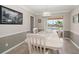 Cozy dining room with a view of the canal, featuring natural lighting, and a classic chandelier at 4754 Overlook Ne Dr, St Petersburg, FL 33703