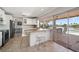 Bright kitchen with granite countertops, stainless steel appliances, and view of the water at 4754 Overlook Ne Dr, St Petersburg, FL 33703