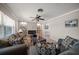 Cozy living room with comfortable seating, stylish decor and a sleek fireplace at 4754 Overlook Ne Dr, St Petersburg, FL 33703