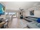 Open living space featuring a bar counter, sliding doors to the water and comfortable seating at 4754 Overlook Ne Dr, St Petersburg, FL 33703