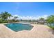 Aerial view of a waterfront home showcasing a pool, dock, and lush landscaping at 4754 Overlook Ne Dr, St Petersburg, FL 33703