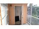 Outdoor balcony with a view of neighborhood landscape and an open storage closet at 5000 Culbreath Key Way # 1-220, Tampa, FL 33611