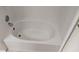 White built-in bathtub with white tile and chrome hardware at 5000 Culbreath Key Way # 1-220, Tampa, FL 33611