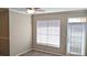 Bedroom with a window and door to outside, creating a comfortable private retreat at 5000 Culbreath Key Way # 1-220, Tampa, FL 33611