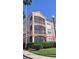 Three-story condo building with screened patios on each level at 5000 Culbreath Key Way # 1-220, Tampa, FL 33611