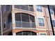 Close up of the three-story condo building with screened patios at 5000 Culbreath Key Way # 1-220, Tampa, FL 33611