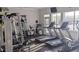 Community gym featuring cardio machines and weight training equipment with natural light from the windows at 5000 Culbreath Key Way # 1-220, Tampa, FL 33611