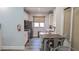 Bright kitchen features white cabinets, stainless steel appliances, and a dining table, enhancing its modern appeal at 5000 Culbreath Key Way # 1-220, Tampa, FL 33611