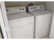 Clean laundry area featuring a white washer and dryer set for convenient home chores at 5000 Culbreath Key Way # 1-220, Tampa, FL 33611