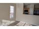 Open living area with a window and a view into the kitchen, creating a seamless flow at 5000 Culbreath Key Way # 1-220, Tampa, FL 33611