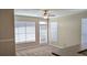 Bright living room featuring three windows and a glass door leading to the outside at 5000 Culbreath Key Way # 1-220, Tampa, FL 33611