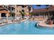 Inviting community pool area surrounded by lounge chairs and well-manicured landscaping at 5000 Culbreath Key Way # 1-220, Tampa, FL 33611
