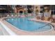 Beautifully maintained community pool with clear blue water and ample lounge seating at 5000 Culbreath Key Way # 1-220, Tampa, FL 33611