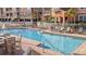 Community pool with lounge chairs and tables offers a great place to relax at 5000 Culbreath Key Way # 1-220, Tampa, FL 33611