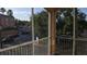 Relaxing balcony view overlooking a quiet street with well-maintained landscaping and nearby buildings at 5000 Culbreath Key Way # 1-220, Tampa, FL 33611