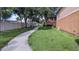 Path with lush green spaces connecting various residences in the community at 5000 Culbreath Key Way # 1-220, Tampa, FL 33611