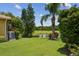 Green backyard with views of the lake at 5103 Shady Stone Pl, Wimauma, FL 33598