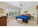 Inviting bedroom with shuttered windows and soft lighting creating comfortable and relaxing retreat at 5103 Shady Stone Pl, Wimauma, FL 33598