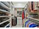Spacious walk-in closet with custom shelving, providing ample storage and organization solutions at 5103 Shady Stone Pl, Wimauma, FL 33598