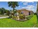 Beautiful home featuring mature landscaping, stone accents and a paver driveway at 5103 Shady Stone Pl, Wimauma, FL 33598