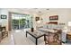 Comfortable living room with sliding glass doors leading to the outdoor patio at 5103 Shady Stone Pl, Wimauma, FL 33598