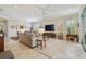 Spacious living room with tile flooring, natural light, and a comfortable seating area at 5103 Shady Stone Pl, Wimauma, FL 33598