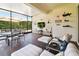 Comfortable sunroom with brick floors, stylish furnishings and outdoor patio access for relaxing or entertaining at 5103 Shady Stone Pl, Wimauma, FL 33598