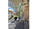 A cozy balcony with a modern chair overlooking lush greenery and mature trees at 5423 Sweetwater Terrace Cir, Tampa, FL 33634