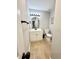 Charming bathroom featuring a modern vanity, sleek black fixtures, and light wood flooring at 5423 Sweetwater Terrace Cir, Tampa, FL 33634
