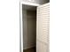 Empty closet with wood-look flooring and white bi-fold doors at 5423 Sweetwater Terrace Cir, Tampa, FL 33634