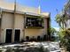 Townhouse exterior with a balcony, comfortable outdoor seating, and well-maintained landscaping at 5423 Sweetwater Terrace Cir, Tampa, FL 33634