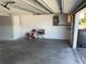 Bright, clean garage offers plenty of storage space, durable flooring, and side access door at 5423 Sweetwater Terrace Cir, Tampa, FL 33634