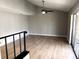 Spacious living room with wood flooring and sliding doors to the balcony at 5423 Sweetwater Terrace Cir, Tampa, FL 33634